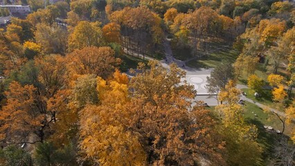 Wall Mural - Aerial drone view of a square in Chisinau, Moldova. Park full of yellowed trees, resting people