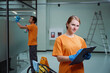 © Svitlana - Professional cleaners accomplishing corporate request according to the checklist