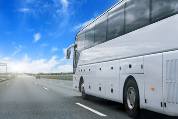 white bus on asphalt road on sunny day, partly cloudy sky in the countryside.