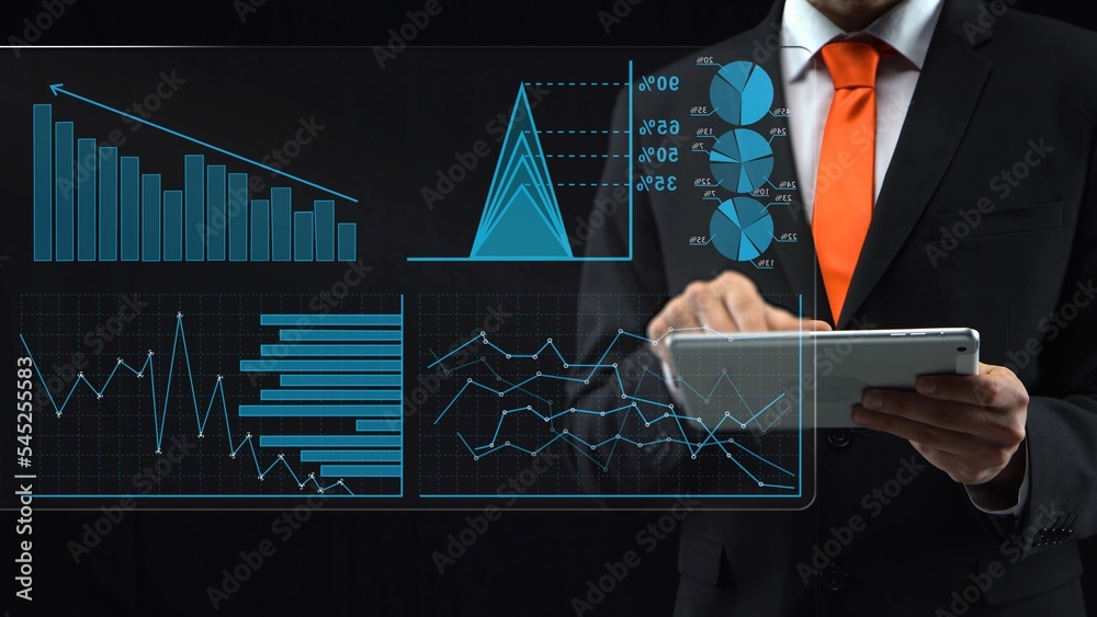 Holographic interface with touch screen and financial graph. Man in a ...