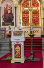 Helsinki, Finland - July 20, 2022: Uspenski Cathedral. Lecture Stand In Front Of Entrance To Sanctuary With Madonna Painting On Side And Pictured Candles In Massive Stands