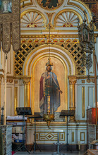 Helsinki, Finland - July 20, 2022: Uspenski Cathedral. Theotokos Of Kozeltshan Icon As Important Painting And Prayer Location. Golden Framing, Huge Hanging Candle Holder And More