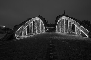 Wall Mural - Christmas decorations on the steel structure of the bridge at night