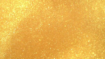 Wall Mural - A movement of gold dust particles. A moving, flowing, stream of Golden particles in sinuous, wavy lines. Chaotic movement of moving shiny glitters . Gold flying particles abstract background. 