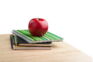 Wall Mural - School teacher's desk with stack of books and apple