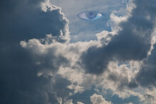 Eye In The Sky Watching From Above. All Seeing Eye In The Sky.  Blue Eye On The Sky Background