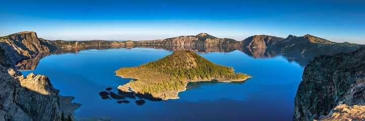 Wall Mural - panoramic view of crater lake from rim to rim on a calm and clear summer evening.