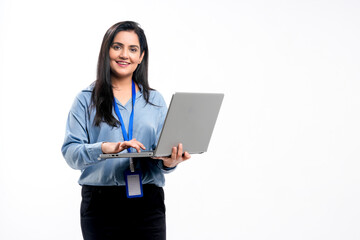 Wall Mural - Indian businesswoman or employee using laptop on white background.