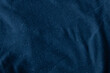 Black dark blue canvas fabric cotton background with folds copy space