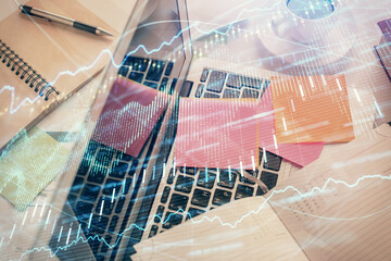 Poster - Multi exposure of financial chart drawing over table background with computer. Concept of research and analysis. Top view.
