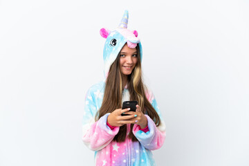 Poster - Little caucasian girl wearing unicorn pajama isolated on white background sending a message with the mobile