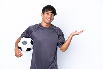 Handsome young football player man isolated on white background extending hands to the side for inviting to come