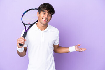 Wall Mural - Handsome young tennis player man isolated on ocher background extending hands to the side for inviting to come