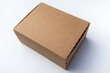 © Svetliy - Cardboard mail box for sending. Courier delivery of cargo.A clean craft box on a white background. A box with a hinged lid and a clean place for the inscription.