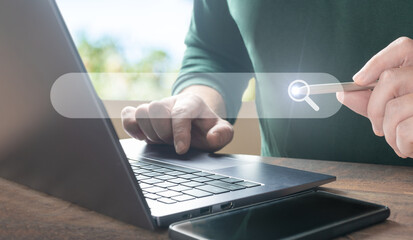 Poster - Man using laptop with internet browser search bar. SEO Search engine optimization, Search technology. Using websites search bar to find desired information or shopping online.