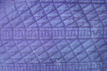 Wall Mural - fabric texture from a piece of violet dirty old matter with a pattern on clothes