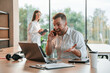© standret - Successful deal. Using laptop. Man and woman are working in the modern office together