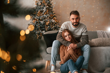 Lovely young couple are celebrating New Year at home