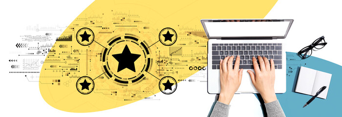 Rating star concept with person using a laptop computer