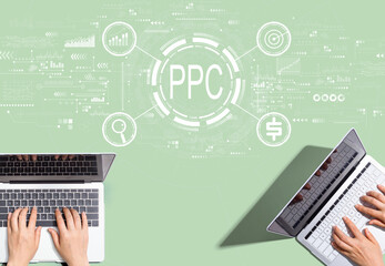 PPC - Pay per click concept with people working together with laptop computers