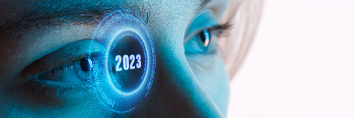 Wall Mural - Close up view of blue eye with futuristic holographic interface to display data. Portrait of beautiful young woman, half of face. Augmented reality, future technology, internet, 2023 concept.