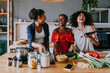 © oneinchpunch - Three mixed race hispanic and black women bonding at home - Multiracial group of happy young female adults spending time together and having fun