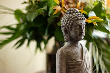 Poster - budda statue in front of flowers - wellness and calm