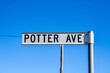 Closeup shot of a Potter Avenue street sign against a blue sky background at Emmaville, Australia