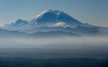 Mount Rainier With Layers Of Forested Foothills