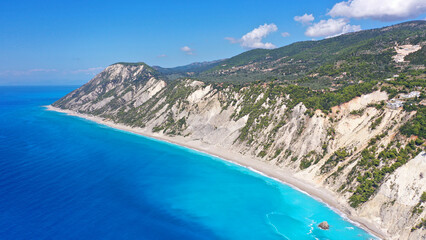 Aerial drone photo of famous paradise beach of Egremni white steep rocky hills overlooking deep turquoise Ionian sea, Lefkada island