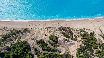 Aerial drone photo of famous paradise beach of Egremni white steep rocky hills overlooking deep turquoise Ionian sea, Lefkada island