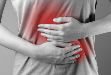 stomach ache concept. hands holding belly abdomen suffering from indigestion, gastrointestinal disea