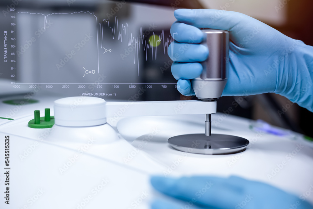 Scientist use the Fourier Transform Infrared spectrometer FTIR to ...