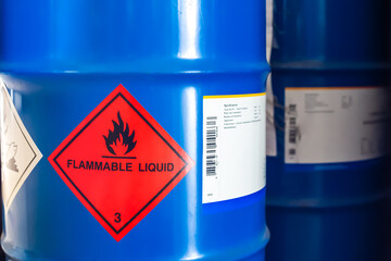 Label of flammable liquid, hazardous chemical warning symbol on the chemical barrel show caution for use, dimethylbutane, methanol, ethanol, butanol. Industrial use and scientific research.