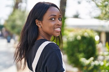 Sticker - Young african american woman smiling confident standing at park