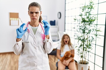 Poster - Young doctor woman putting vaccine to little girl depressed and worry for distress, crying angry and afraid. sad expression.