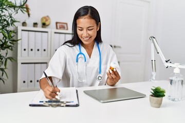 Sticker - Young latin woman wearing doctor uniform working at clinic