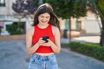 Sticker - Young caucasian woman smiling confident using smartphone at park