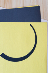 Canvas Print - semi circle shape on yellow, black, and wood surface