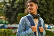 © Krakenimages.com - Hispanic young man smiling wearing headphones at the university campus