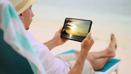 Poster - Man Watching TV Film Or Video On Tablet
