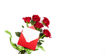 A Bouquet Of Red Roses, A Red Envelope With An Empty Piece Of Paper For Congratulations Or A Declaration Of Love On A White Isolated Background. Banner. Valentine's Day, Mother's Day, Birthday.