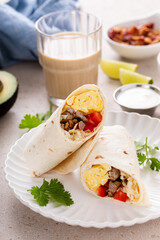 Wall Mural - Breakfast burrito with sausage, eggs, bell pepper and cheese