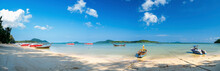 Boats In Rawai Beach, Phuket, Thailand. Panoramic View Of The Beach Of Rawai On The Island, With Traditional Long Tail Fishing Boats Anchored On The Beach.