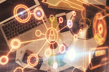 Poster - Social network hologram drawings over computer on the desktop background. Top view. Double exposure.
