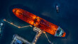 © Darunrat - Aerial top view industrial crude oil fuel tanker ship at terminal industrial port,  Tanker ship unloading crude oil, Industry refinery fuel chemical import export business logistic and transportation.
