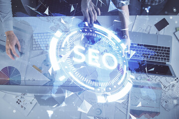Poster - Double exposure of man and woman working together and seo drawing hologram. Technology concept. Computer background.
