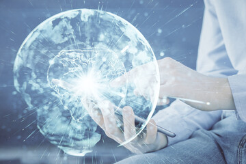 Aufkleber - Double exposure of man's hands holding and using a phone and international business theme drawing.