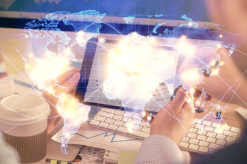 Poster - Double exposure of man's hands holding and using a phone and international business theme drawing.