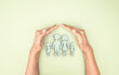 Hand holding covered 3d family symbolic icon, planning family protection by insurance or family care and support concept